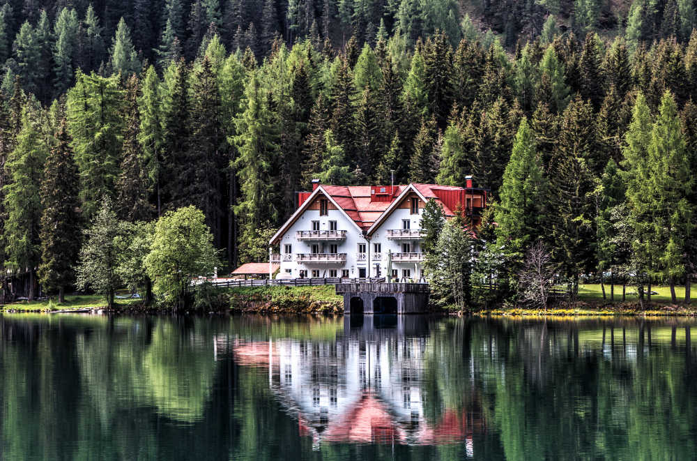Scenic exterior view of luxury countryside lodge accommodations nestled in a lush resort setting